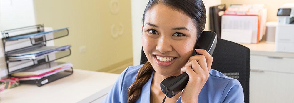 A Hawaii dental plan staff member answers questions on the phone.