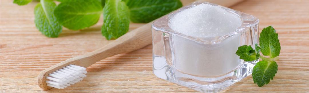 A wooden tooth brush and natural tooth paste xylitol are used to fight bad breath