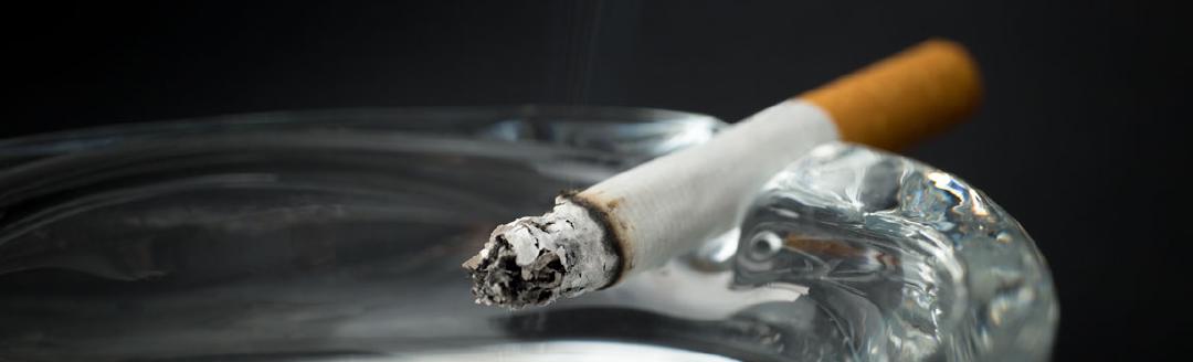 A cigarette is shown on an ashtray